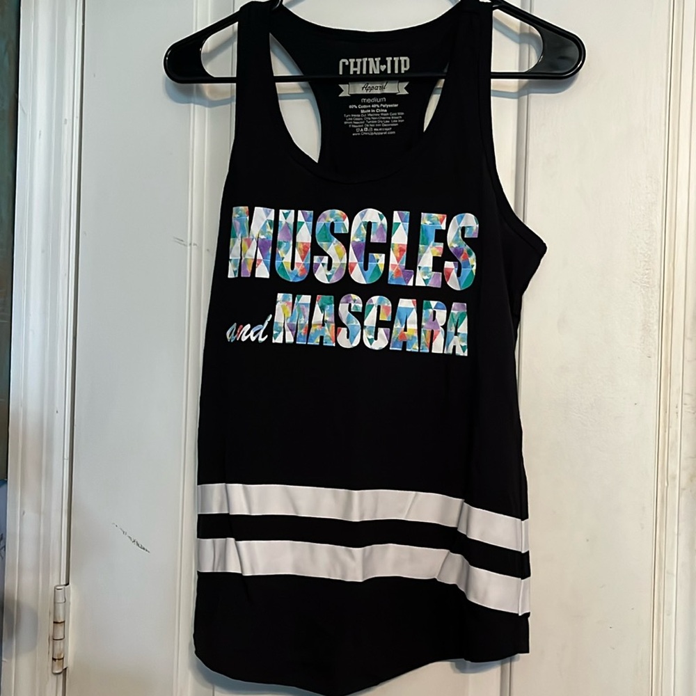 Women’s size Medium sports tank top. Black, white & multi Muscles and mascara.